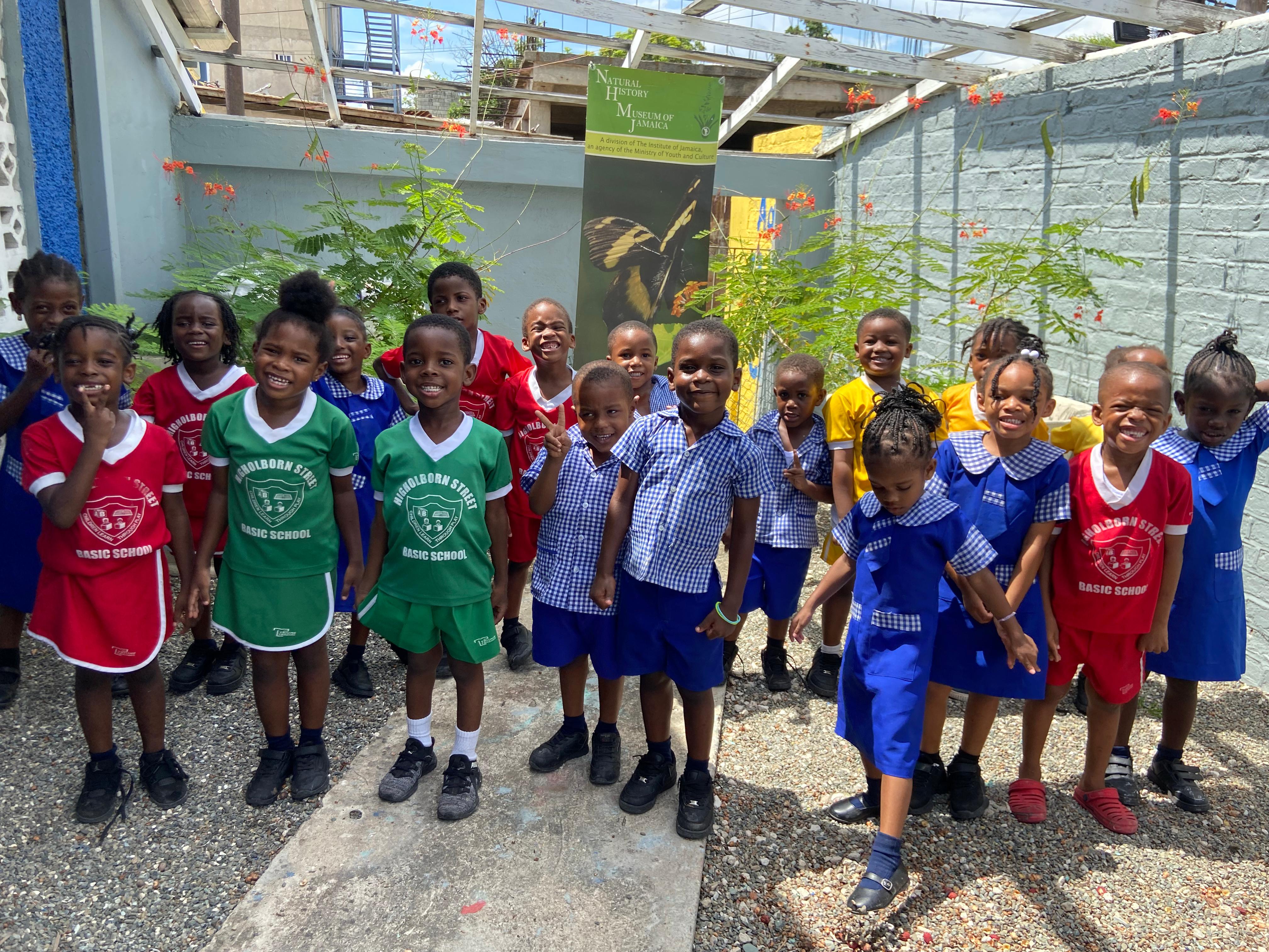 Higholborn Students with seedlings of Pride of Barbadoes planted a year prior Higholborn Students with seedlings of Pride of Barbadoes planted a year prior