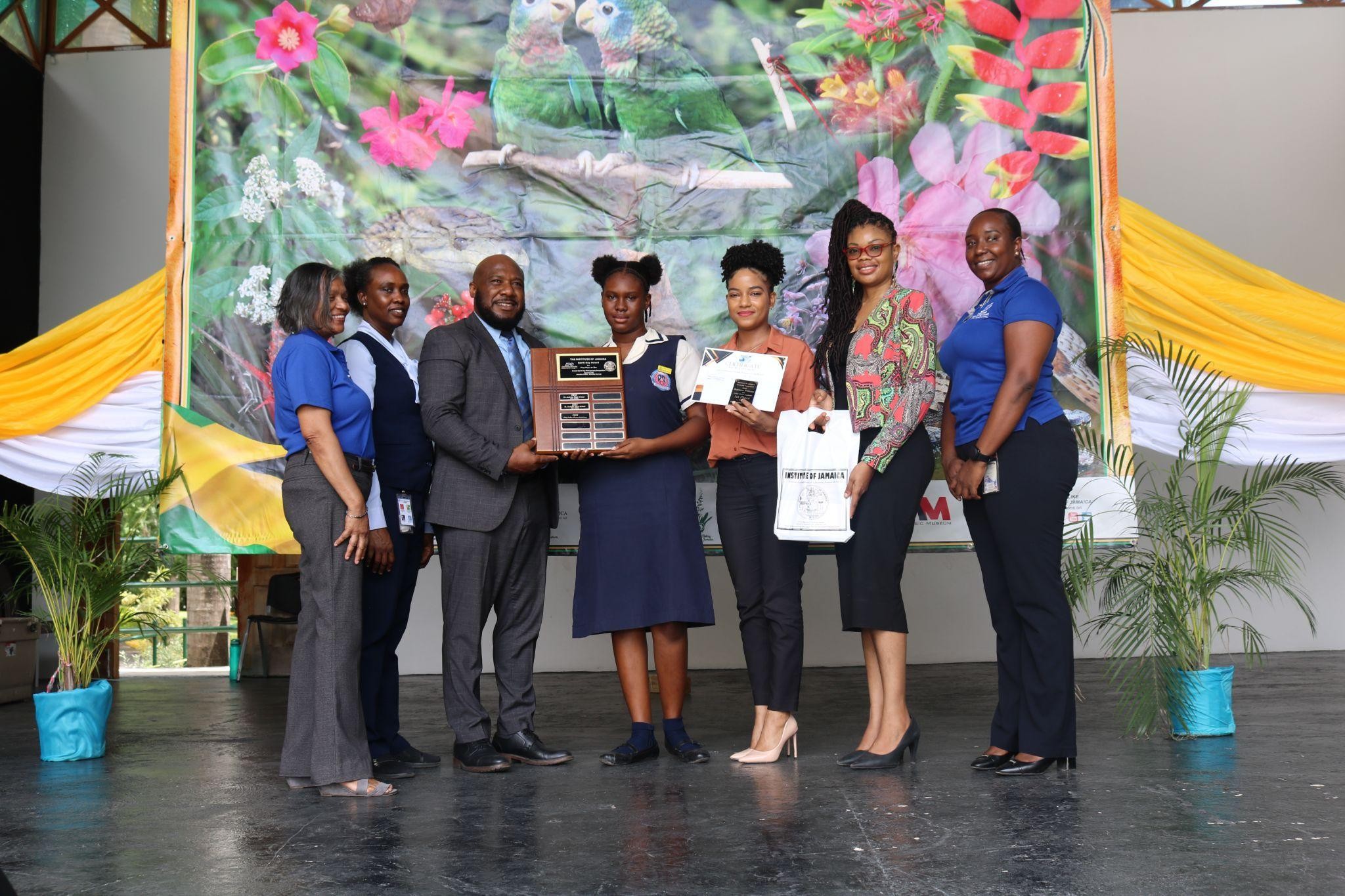 Winner of the Poetry category of the competition pose with sponsors,  Judge, guest speaker and former Executive Director of the Institute of  Jamaica